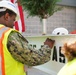 Capt. Atiim Senthill, NAVFAC Washington operations officer, signs steel beam at JADOC Phase Two construction site