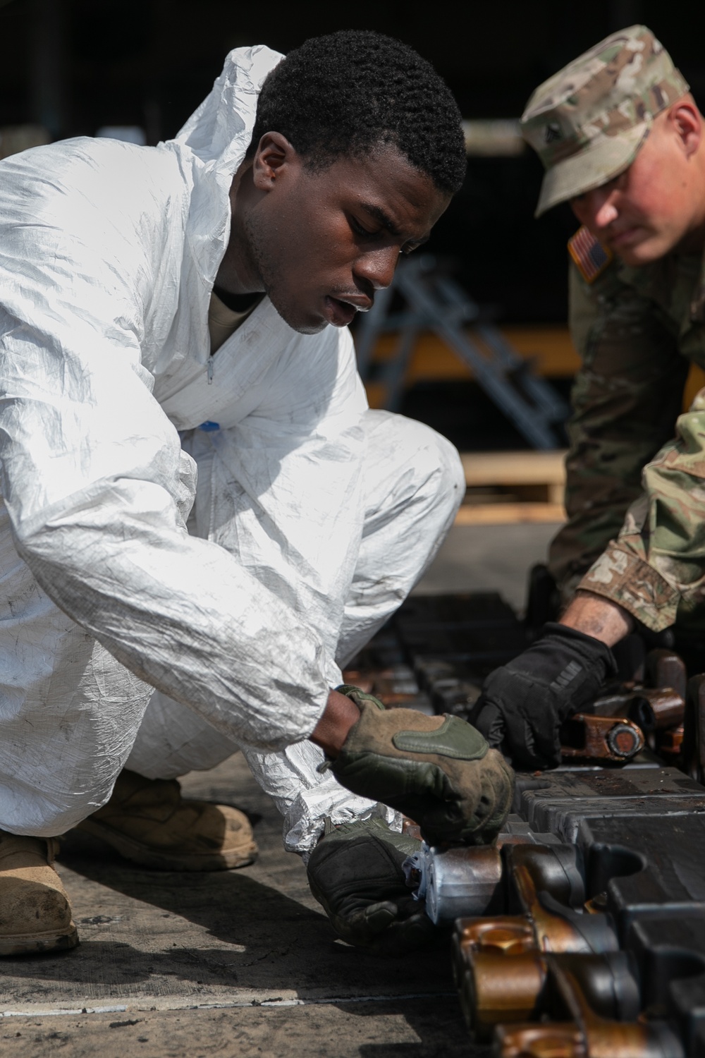 1st AD Soldiers and Australian contractors team up to repair M1A2 Abrams tank