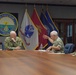 Adm. Grady receives a brief at Naval Base Guam