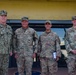 Adm. Christopher Grady poses with members of the 36th Wing.