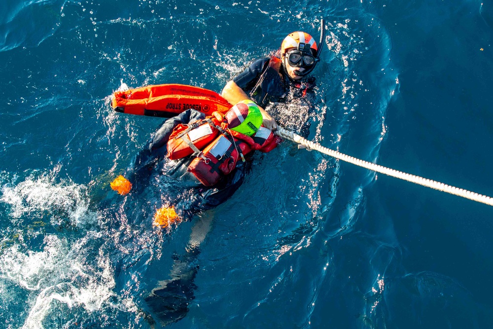 GMSN Guillen Secures a Simulated Man Overboard to a Rescue Strop