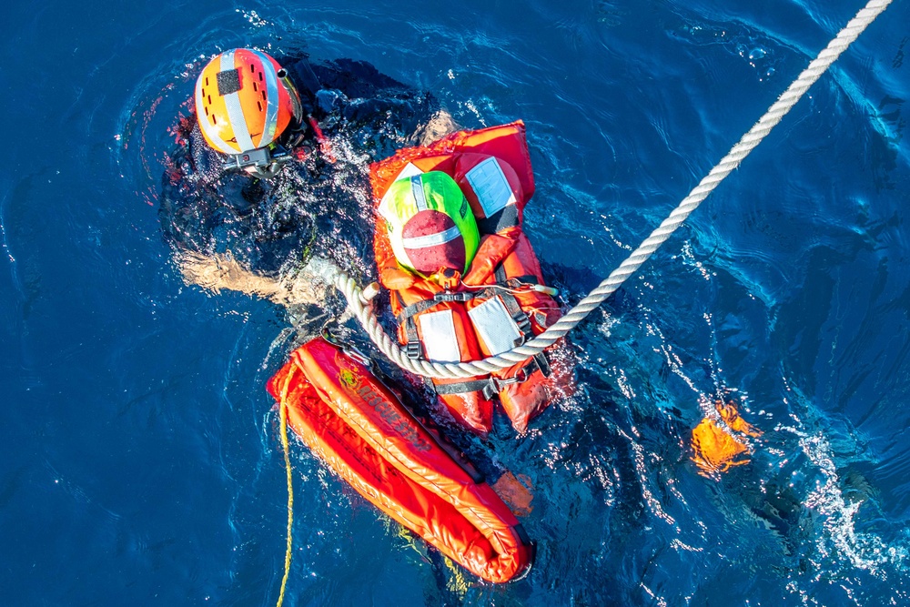 GMSN Guillen Secures a Simulated Man Overboard to a Rescue Strop