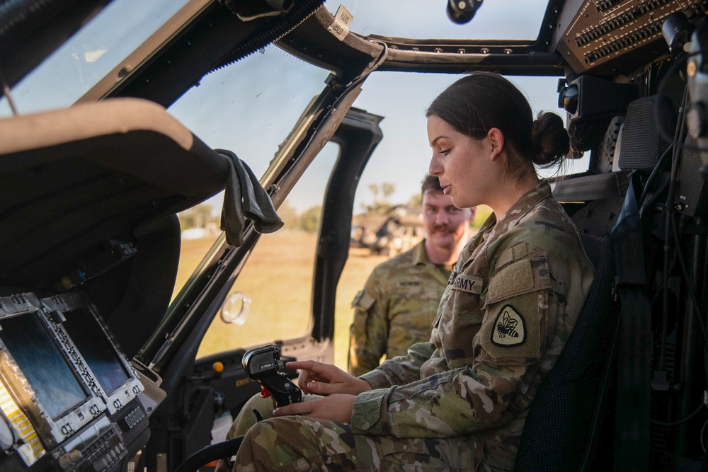 Soldiers from the 1-52nd General Support Aviation Battalion, U.S. Army, train soldiers from the 144th Area Support Company, UTANG, on medical evacuation procedures during Talisman Sabre 2023