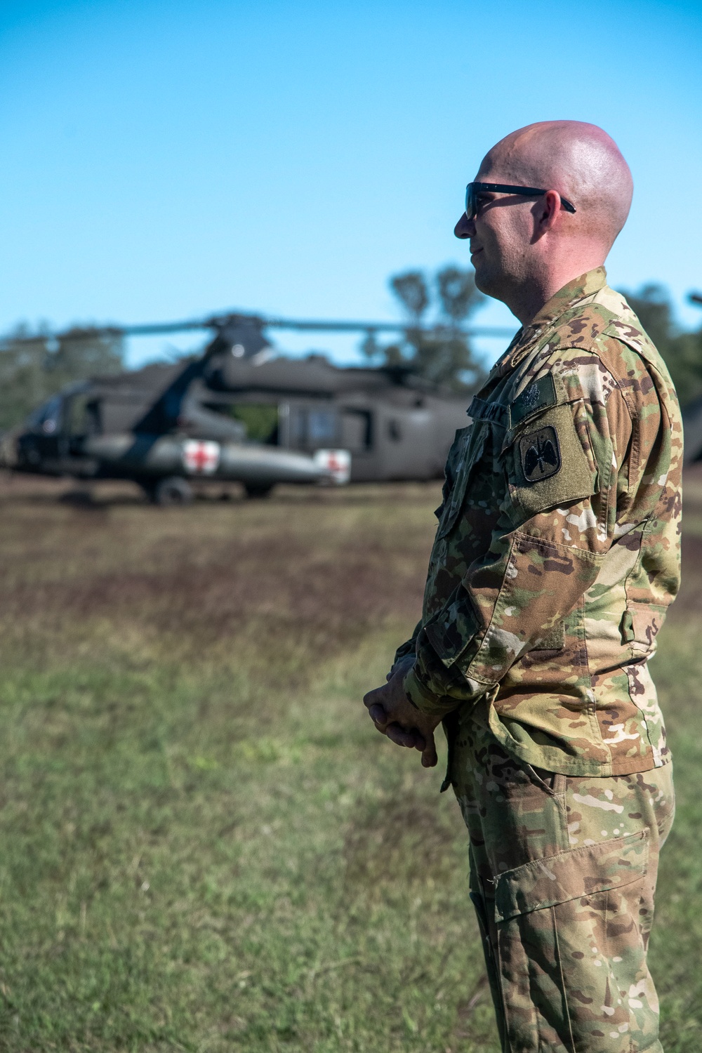 Soldiers from the 1-52nd General Support Aviation Battalion, U.S. Army, train soldiers from the 144th Area Support Company, UTANG, on medical evacuation procedures during Talisman Sabre 2023