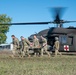 Soldiers from the 1-52nd General Support Aviation Battalion, U.S. Army, train soldiers from the 144th Area Support Company, UTANG, on medical evacuation procedures during Talisman Sabre 2023