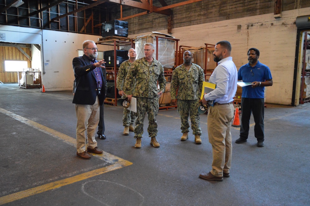NAVSUP FLCSD leadership explore the warehouse at Naval Base Ventura County on July 18, 2023.