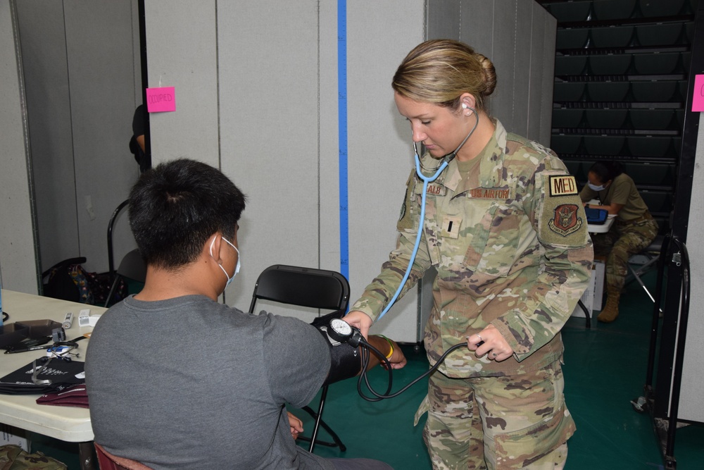 Air Force Nurse assists during Guam Wellness IRT