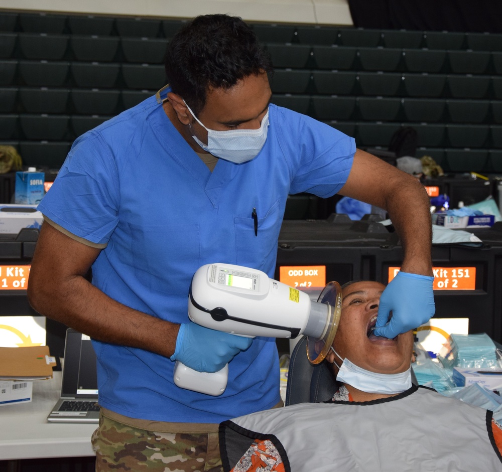 Dentist assists in Guam Wellness IRT