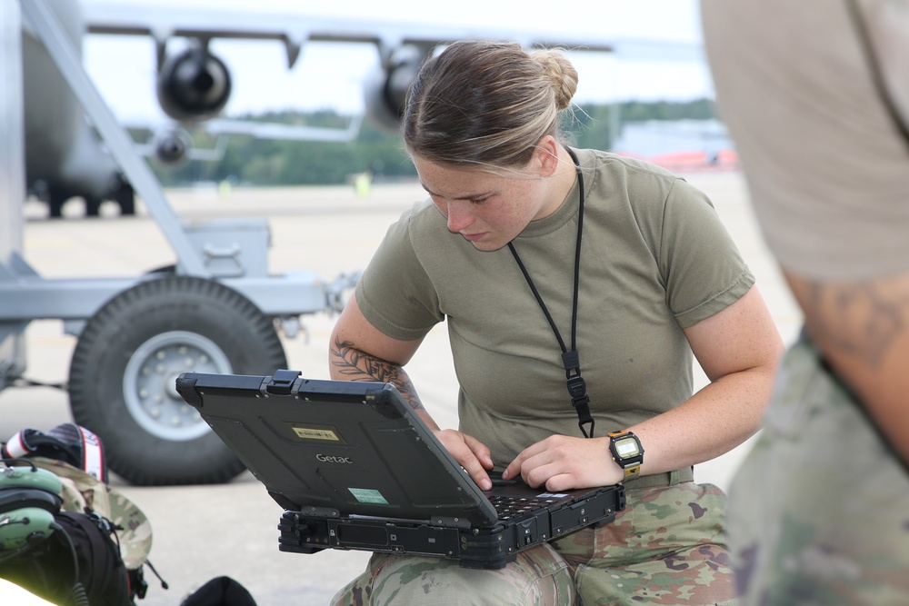 445th AMXS changes nose tires on C-17