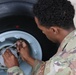 445th AMXS changes nose tires on C-17