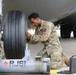 445th AMXS changes nose tires on C-17