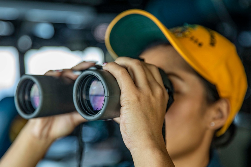 Ralph Johnson Sailors stand watch in the South China Sea.