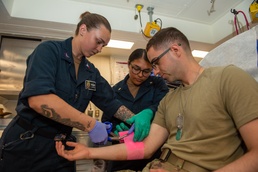 USU Students Receive Operational Medicine Training Onboard USS Boxer (LHD 4)