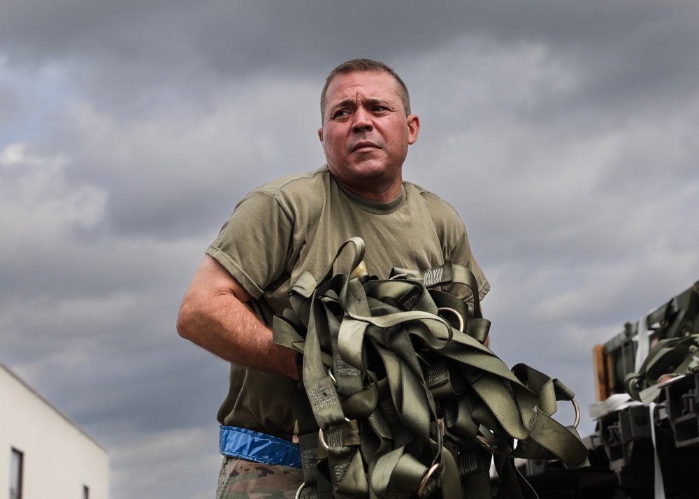 Airmen from the 87th and 721st Aerial Port Squadrons move explosive cargo at Ramstein Air Base, Germany