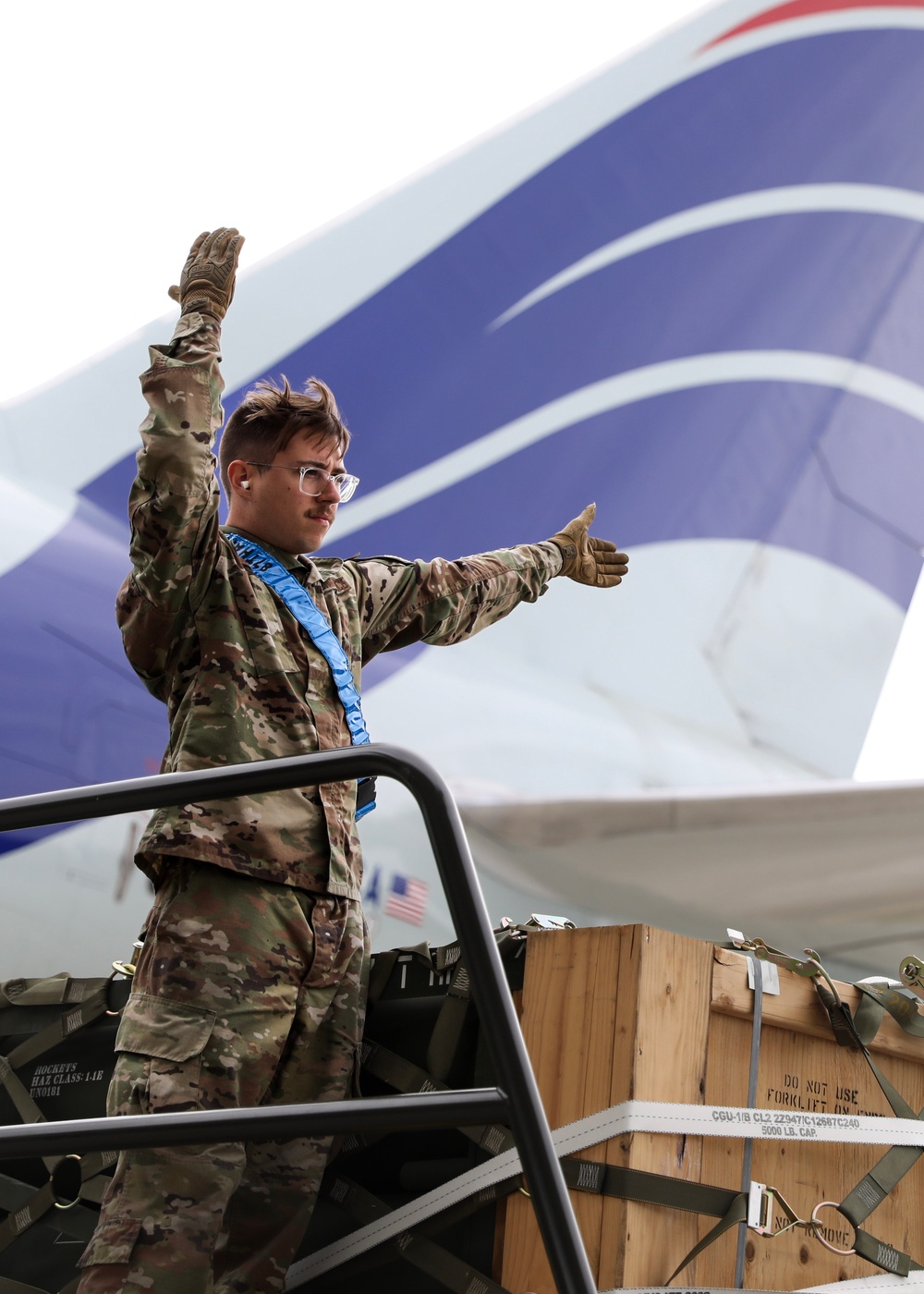 Airmen from the 87th and 721st Aerial Port Squadrons move explosive cargo at Ramstein Air Base, Germany