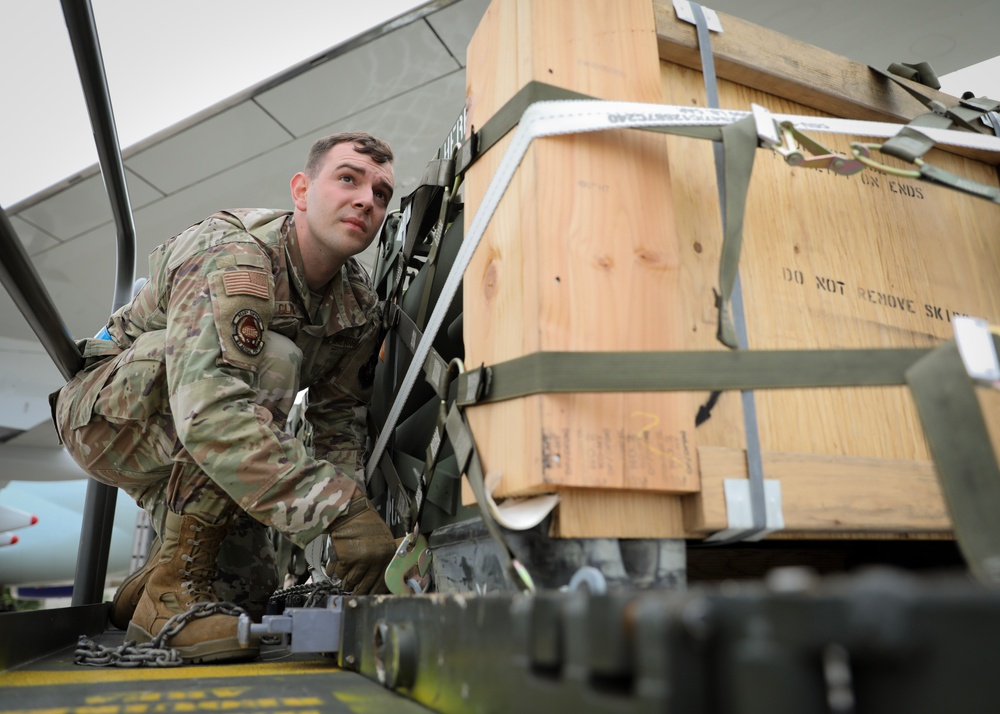 Airmen from the 87th and 721st Aerial Port Squadrons move explosive cargo at Ramstein Air Base, Germany