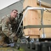 Airmen from the 87th and 721st Aerial Port Squadrons move explosive cargo at Ramstein Air Base, Germany