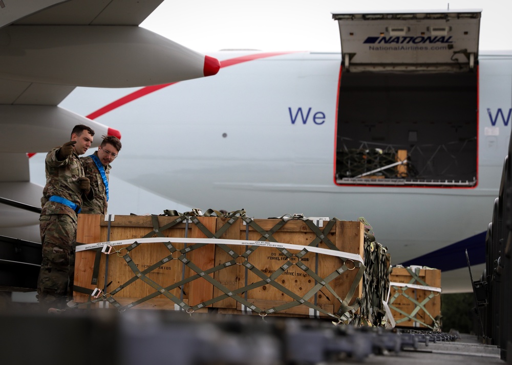 Airmen from the 87th and 721st Aerial Port Squadrons move explosive cargo at Ramstein Air Base, Germany