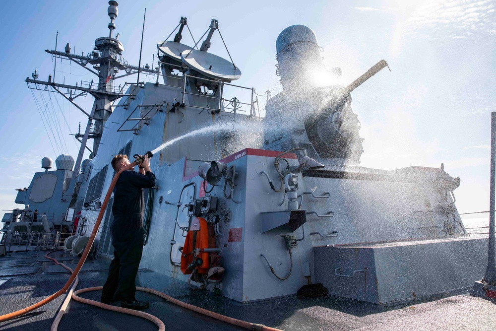 Ralph Johnson Sailors conduct a fresh water washdown in the South China Sea.