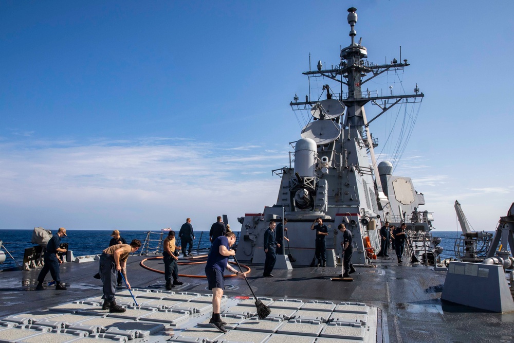 Ralph Johnson Sailors conduct a fresh water washdown in the South China Sea.