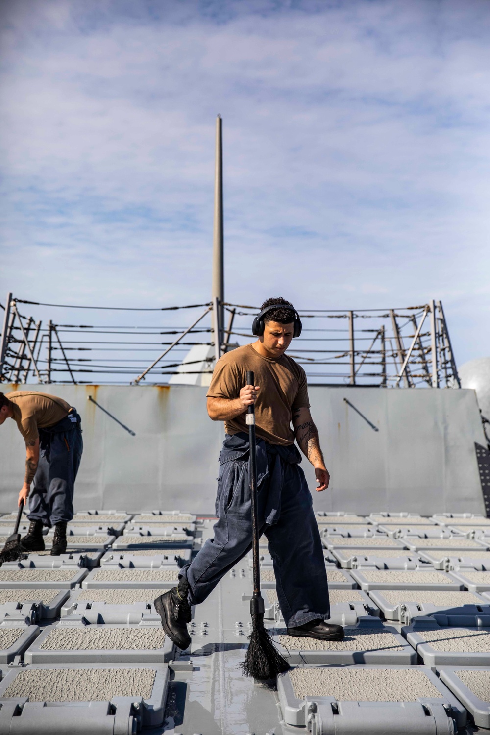 Ralph Johnson Sailors conduct a fresh water washdown in the South China Sea.