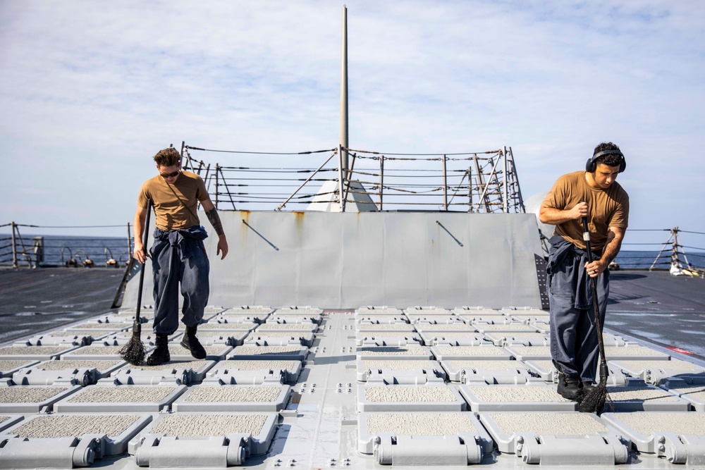 Ralph Johnson Sailors conduct a fresh water washdown in the South China Sea.