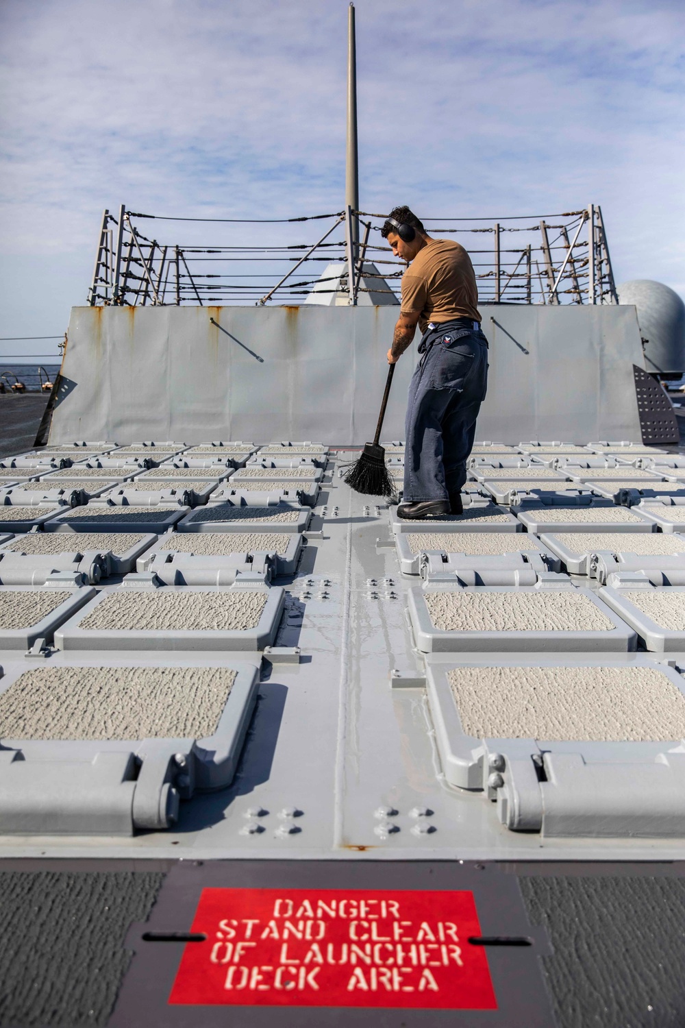 Ralph Johnson Sailors conduct a fresh water washdown in the South China Sea.