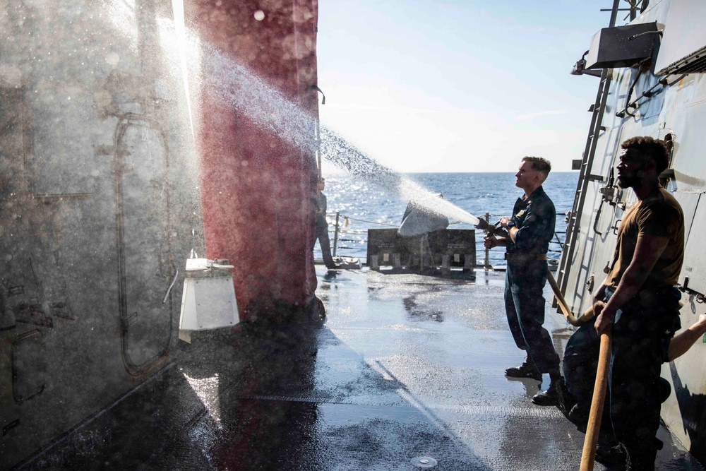 Ralph Johnson Sailors conduct a fresh water washdown in the South China Sea.