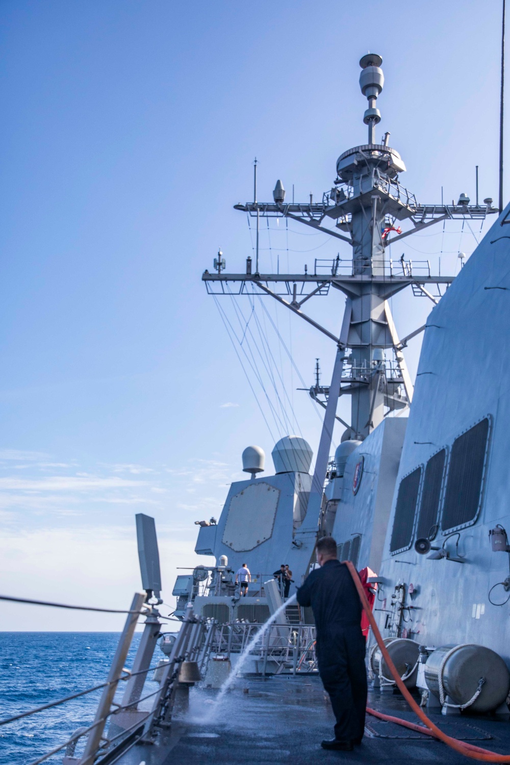 Ralph Johnson Sailors conduct a fresh water washdown in the South China Sea.