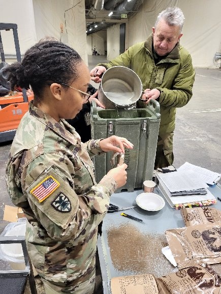 Staff Sgt. Lenee Williams, veterinary food inspector and noncommissioned officer in charge of the Stuttgart Veterinary Treatment Facility, conducting a Meals Ready To Eat inspection.