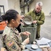 Staff Sgt. Lenee Williams, veterinary food inspector and noncommissioned officer in charge of the Stuttgart Veterinary Treatment Facility, conducting a Meals Ready To Eat inspection.