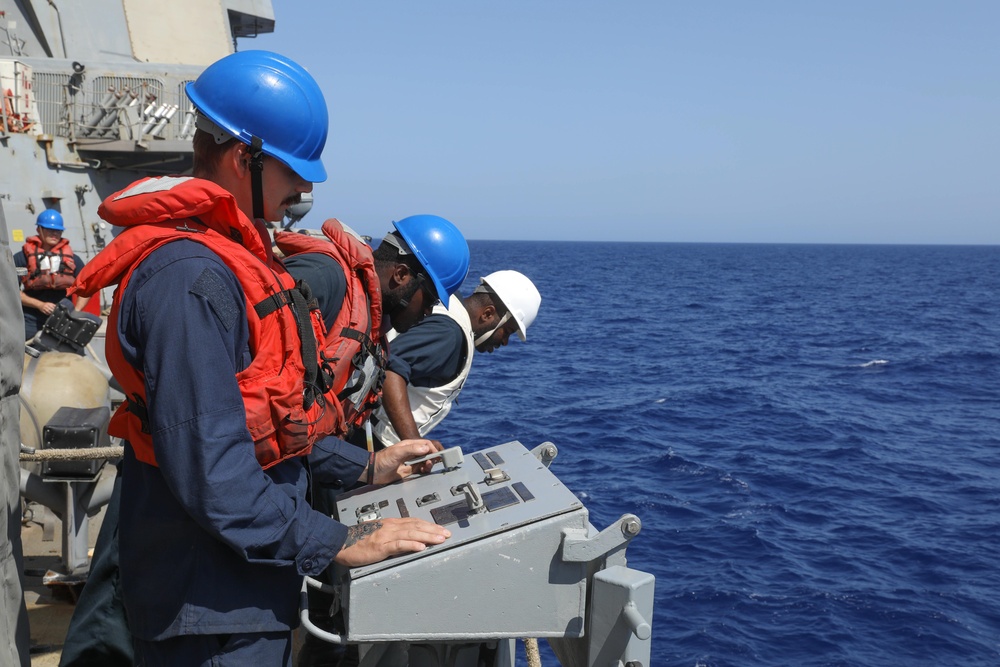 Ramage Sailors Operate Crane