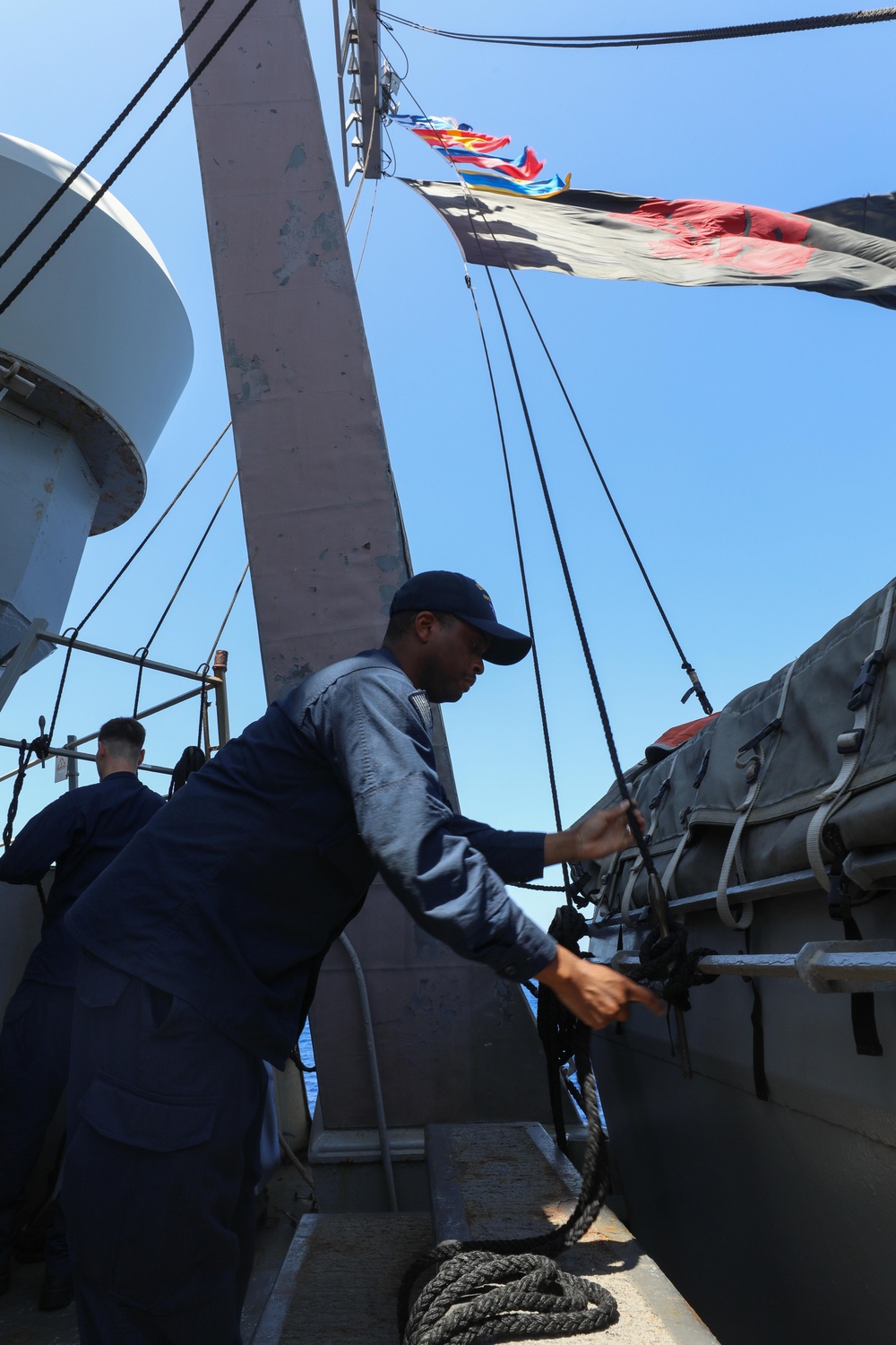 Ramage Sailor Raises SIgnal Flags