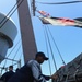 Ramage Sailor Raises SIgnal Flags