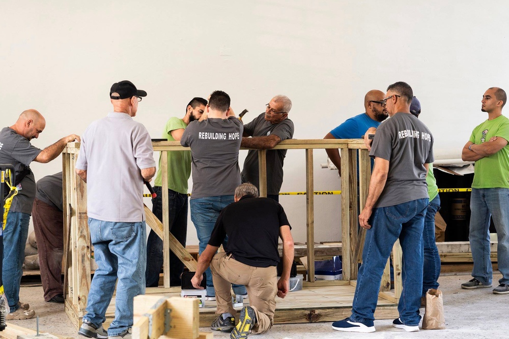 Local Voluntary Agencies Collaborate with Mennonite Disaster Service in Trujillo Alto, Puerto Rico, to Enhance Construction Skills