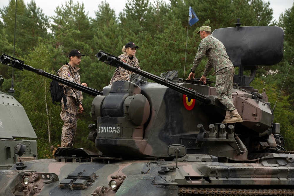 Task Force Ivy, NATO soldiers familiarize junior cadets with military equipment during Baltic Guard