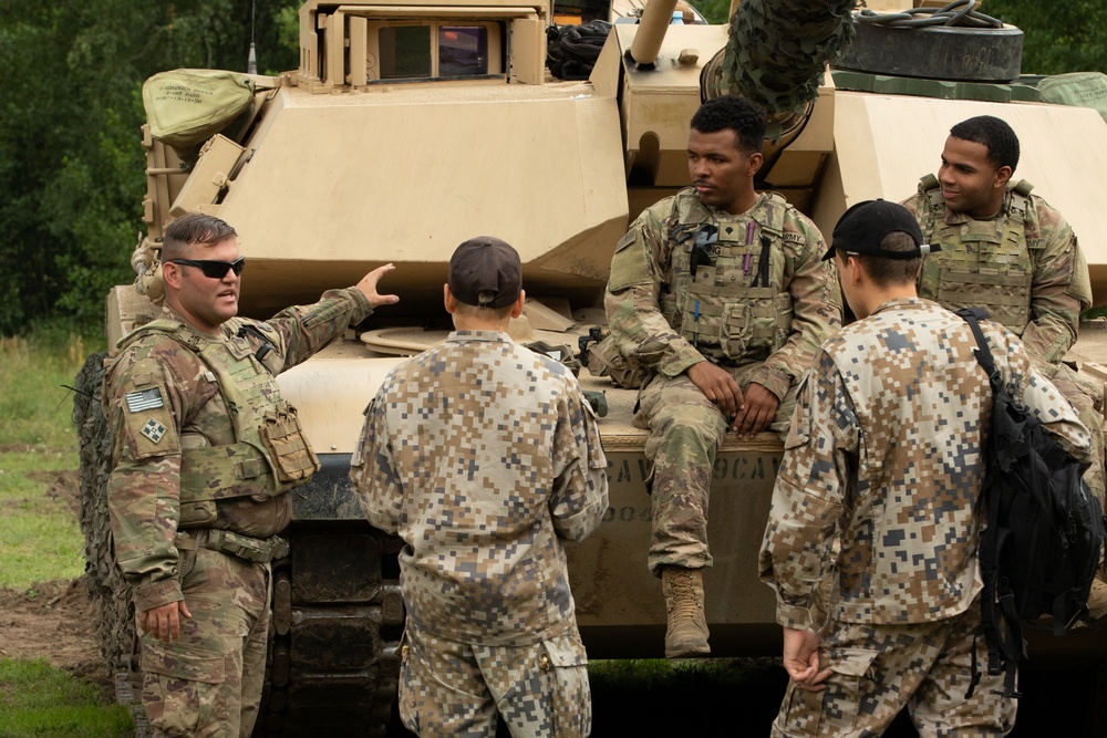 Task Force Ivy, NATO soldiers familiarize junior cadets with military equipment during Baltic Guard