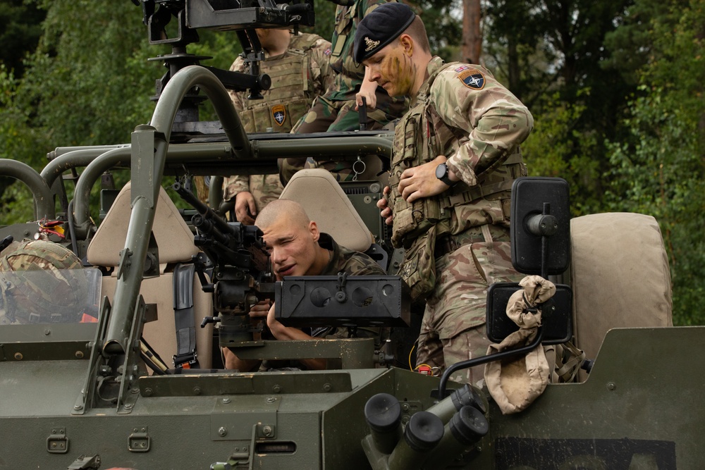 Task Force Ivy, NATO soldiers familiarize junior cadets with military equipment during Baltic Guard