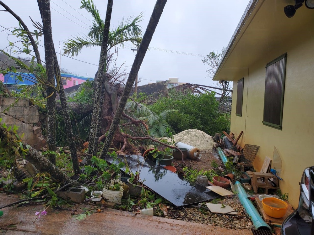 Members of the Air Force Civil Engineer Center’s Natural Disaster Recovery Division, who have family in Guam, received photos of the home and tree damage after Typhoon Mawar