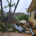 Members of the Air Force Civil Engineer Center’s Natural Disaster Recovery Division, who have family in Guam, received photos of the home and tree damage after Typhoon Mawar