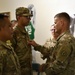 BG Siekman promotes soldier during Guam Wellness IRT