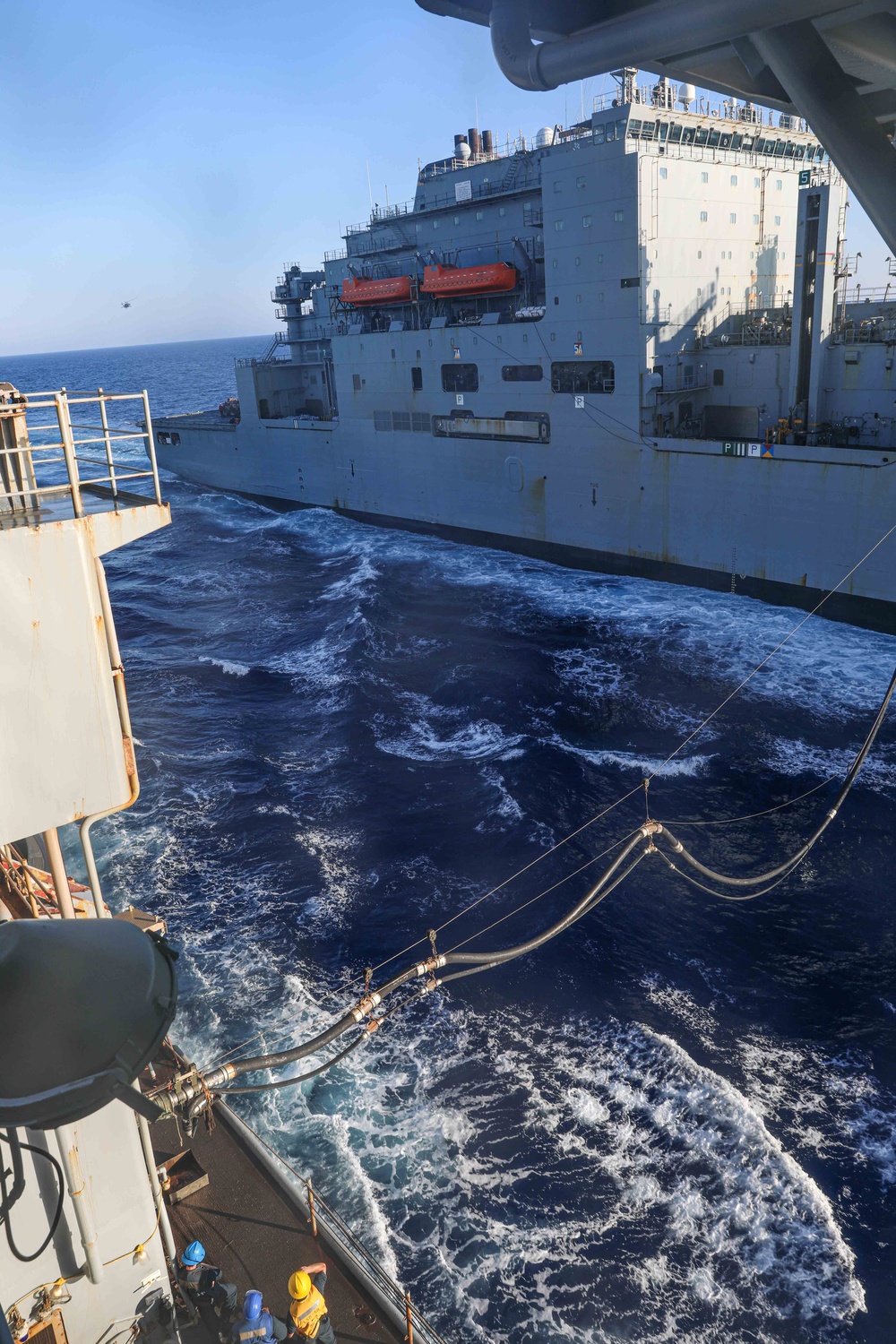 USS Carter Hall, USNS Medgar Evers conduct a replenishment-at-sea