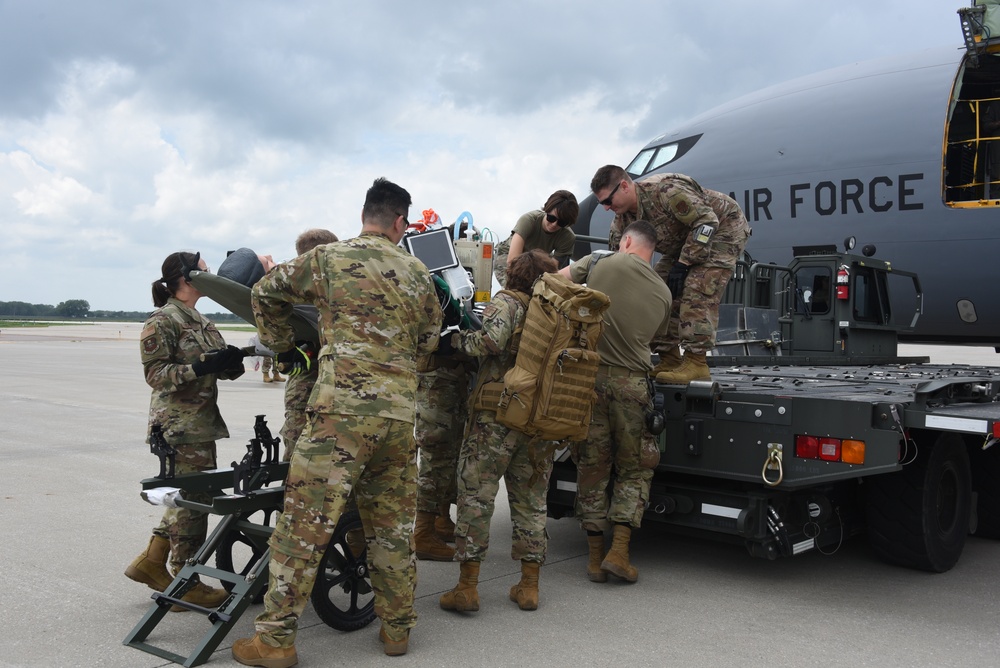 185th ARW medical group load simulated patient onto aircraft