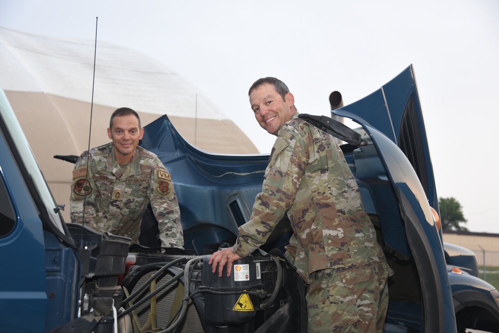 185th ARW twin brothers pose for a photo