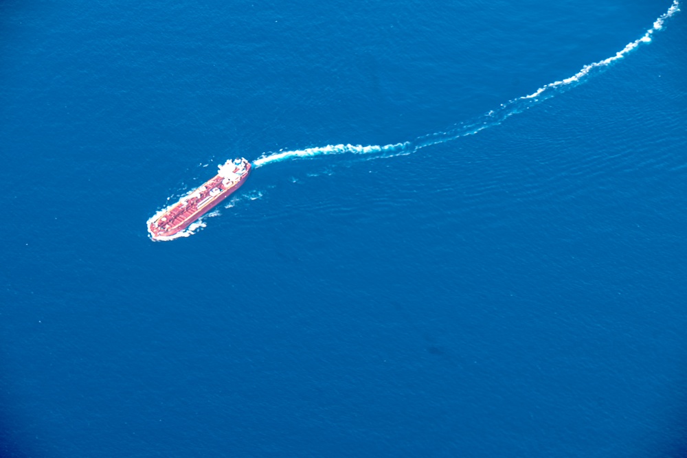 U.S. Air National Guard unit provide aerial observation support to a Coast Guard overwater rescue