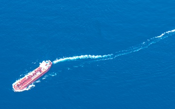 U.S. Air National Guard unit provide aerial observation support to a Coast Guard overwater rescue