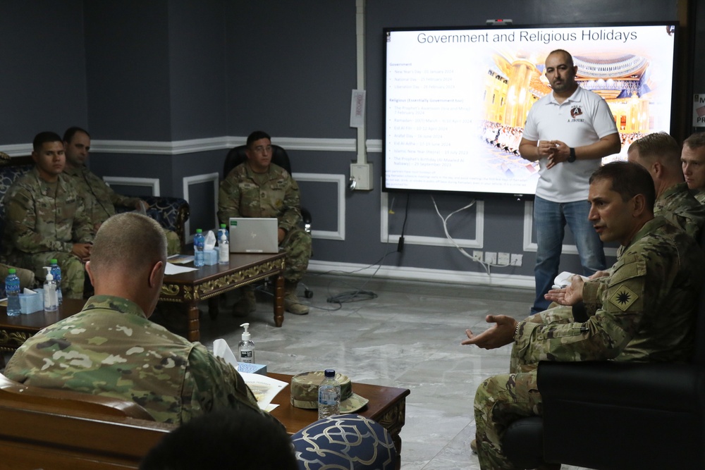 Key leaders from the Task Force Spartan engage in a cultural brief about government and religious holidays