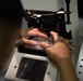 Optical laboratory specialist fabricates prescription glasses