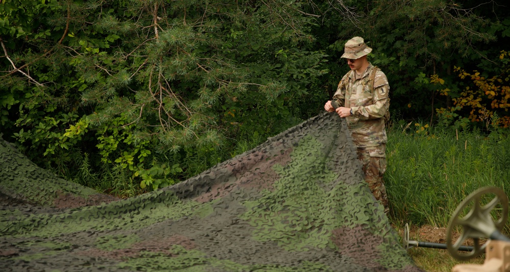 205th MCGA assembles camouflage netting