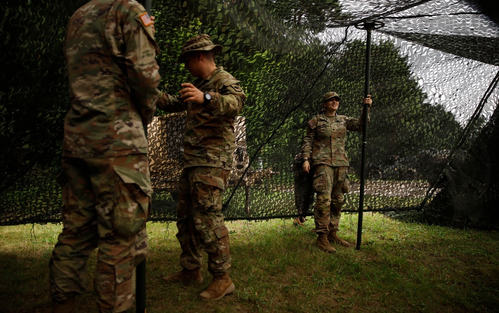 205th MCGA assembles camouflage netting